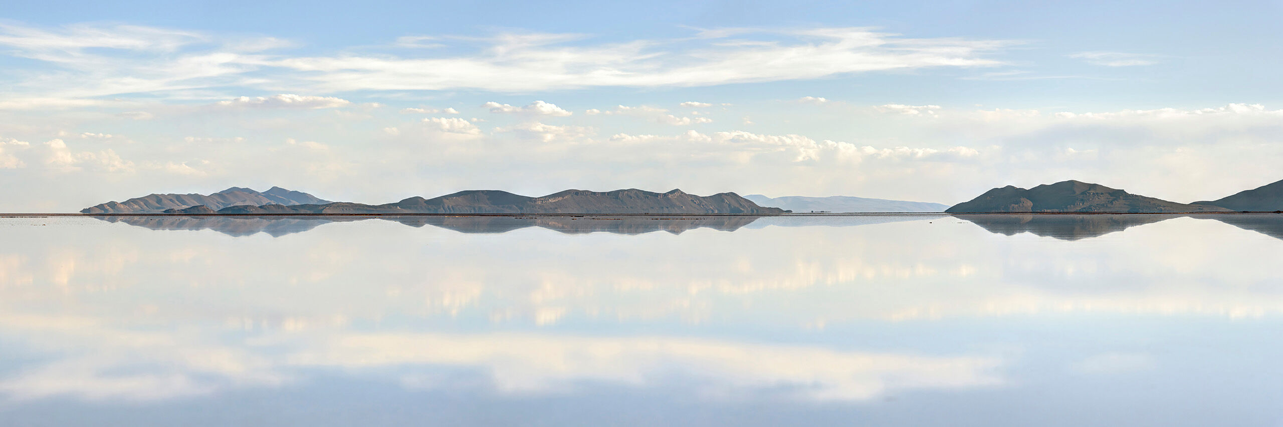 Perfect Mirror Panorama Sitting at roughly 12,000 feet above sea level, the Salar de Uyuni is, at over 3,900 square miles, the world's largest salt flat...