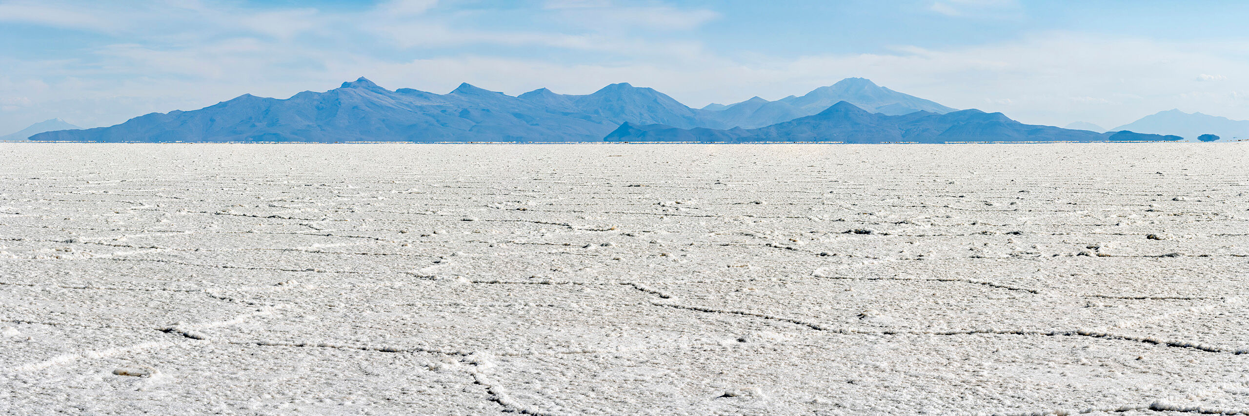 Salty Panorama Sitting at roughly 12,000 feet above sea level, the Salar de Uyuni is, at over 3,900 square miles, the world's largest salt flat...