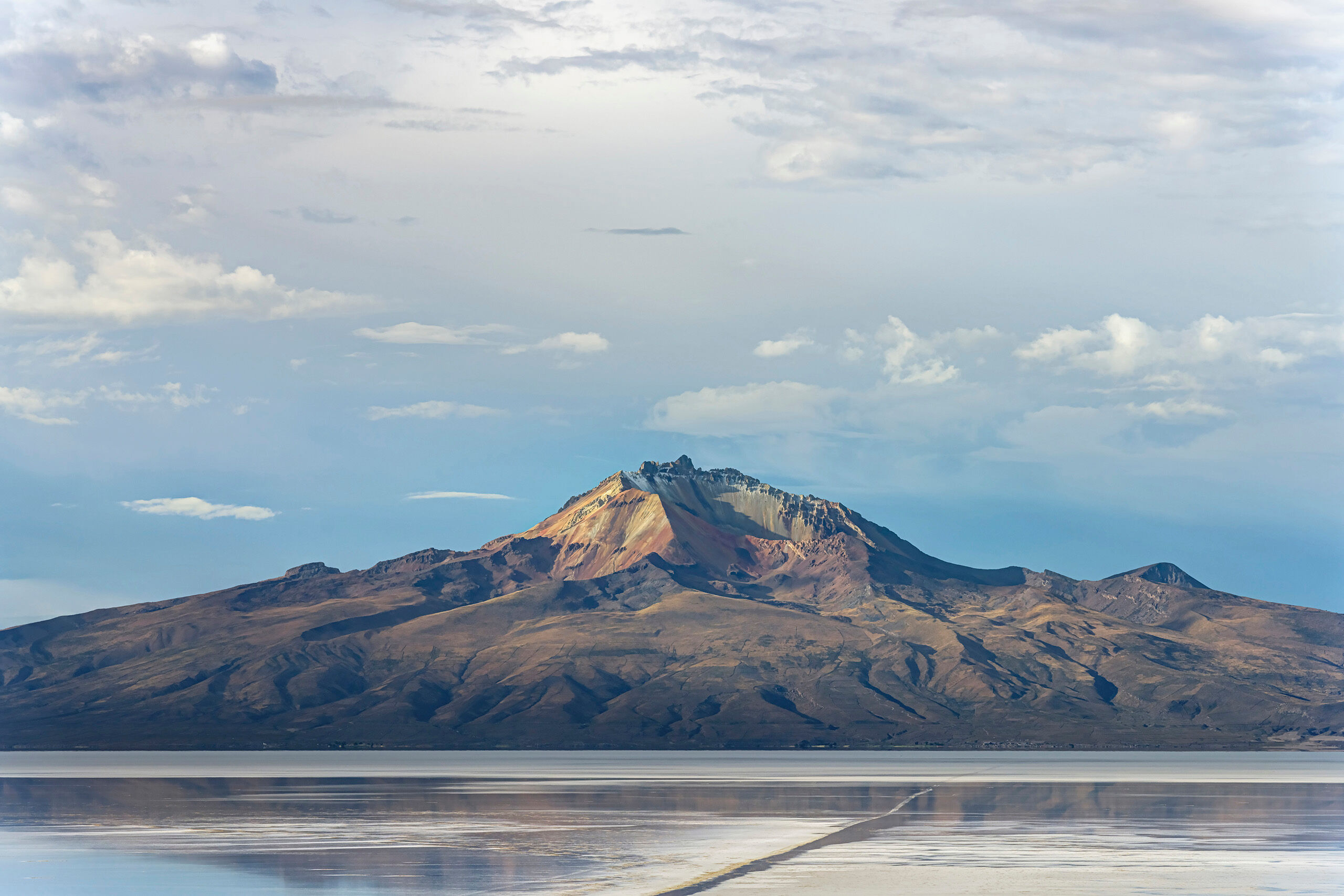 Tunupa Southwest Bolivia's dormant Volcàn Tunupa, which reaches an elevation of 17,457 feet, lies at the northern edge of el...