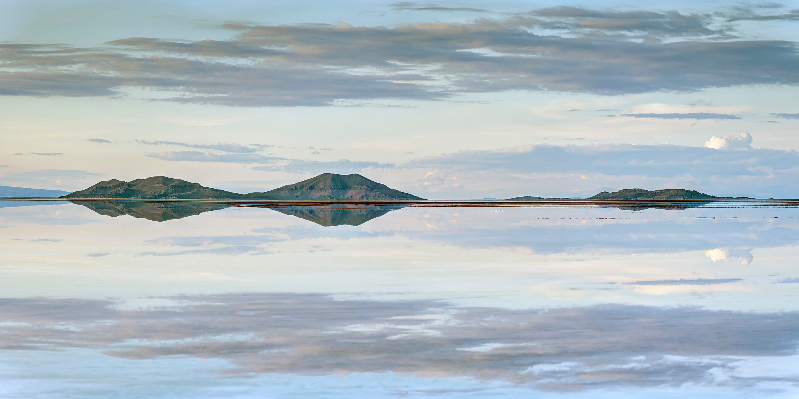 Two Sets of Mountains Sitting at roughly 12,000 feet above sea level, the Salar de Uyuni is, at over 3,900 square miles, the world's largest salt flat...