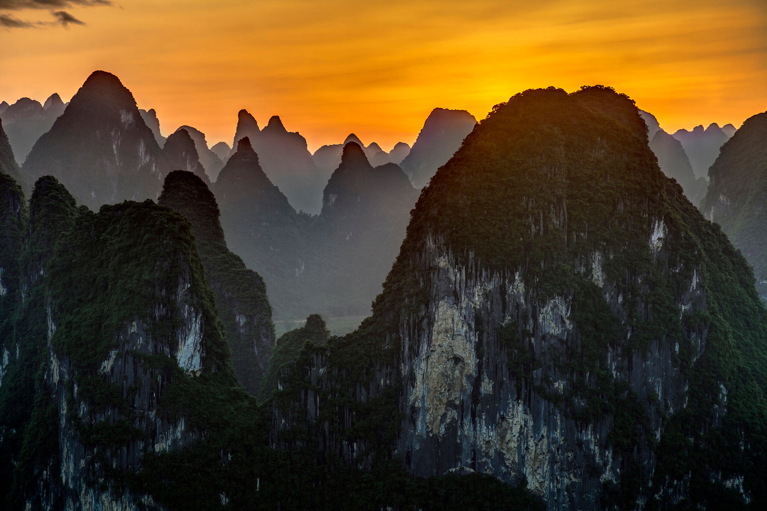 Laozhai Hill Sunset I took this photo from Laozhai Hill, which lies on the edge of the Chinese village of XingPing. XingPing is surrounded by thousand...