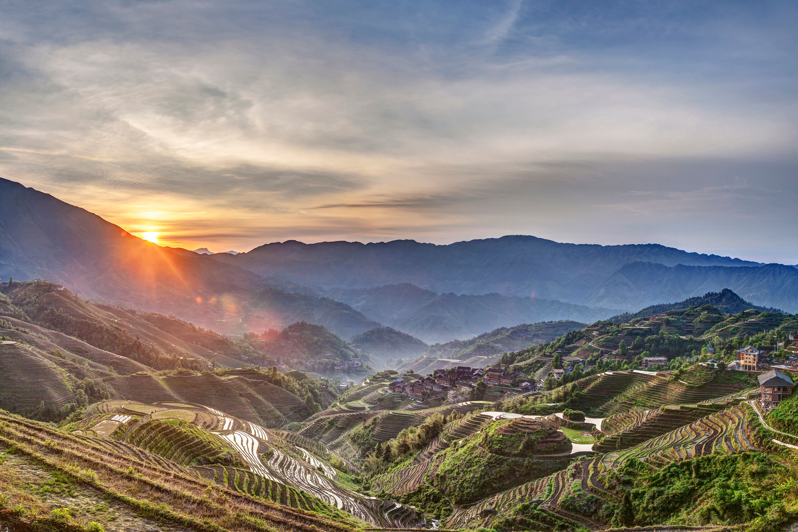 Sunrise at Music From Paradise The Longji (sometimes called Longsheng) Rice Terraces, in Guangxi Province, China, are beautiful, and reminiscent of a nearly...