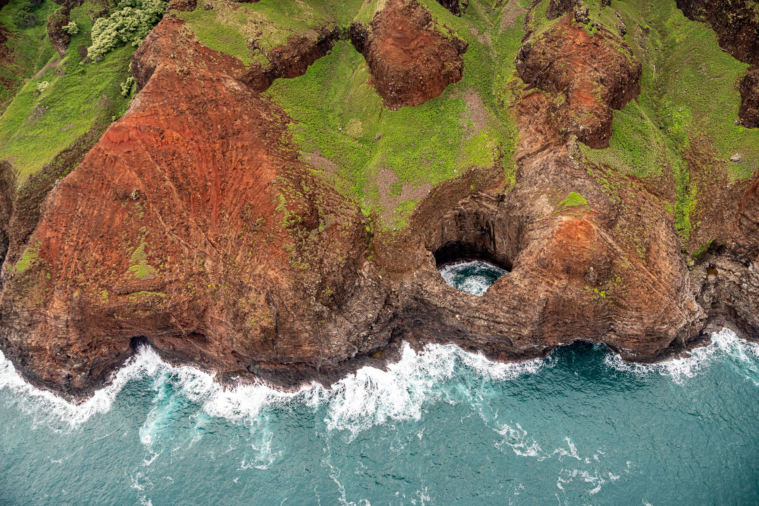 Bird's Eye view of the Napali Coast Nope, I don't own a drone (as of early 2020). I took this photo looking down from a “door's off” helicopter on the...