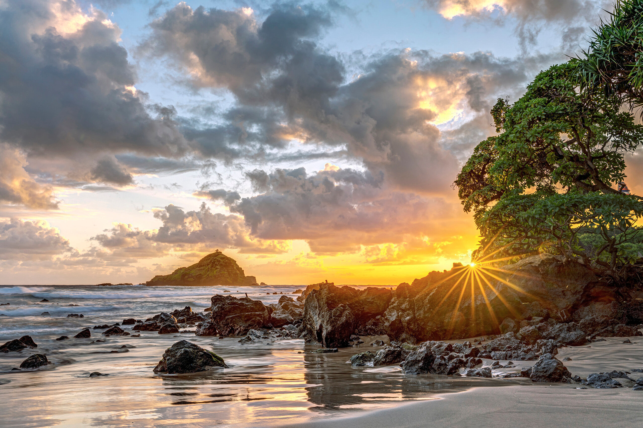 Sunrise at Koki Beach Maui's “Road to Hana” is a 64 mile long two-lane road through lush jungles on the southern part of the island. Despite...