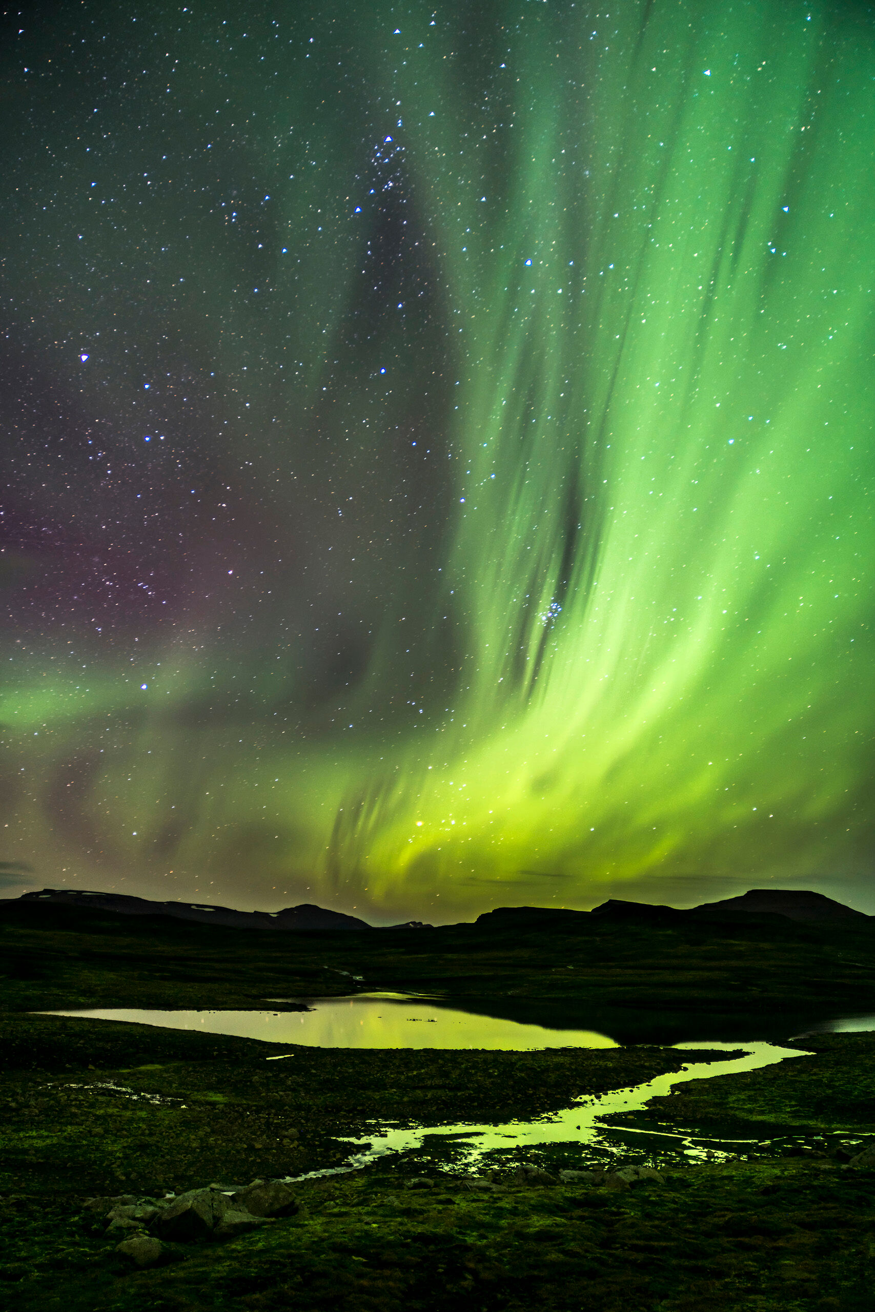 Aurora Borealis over Mountain Lake It took me several compositions to get the shot I wanted here, of the Aurora Borealis lighting up the star-filled sky, and reflecting...