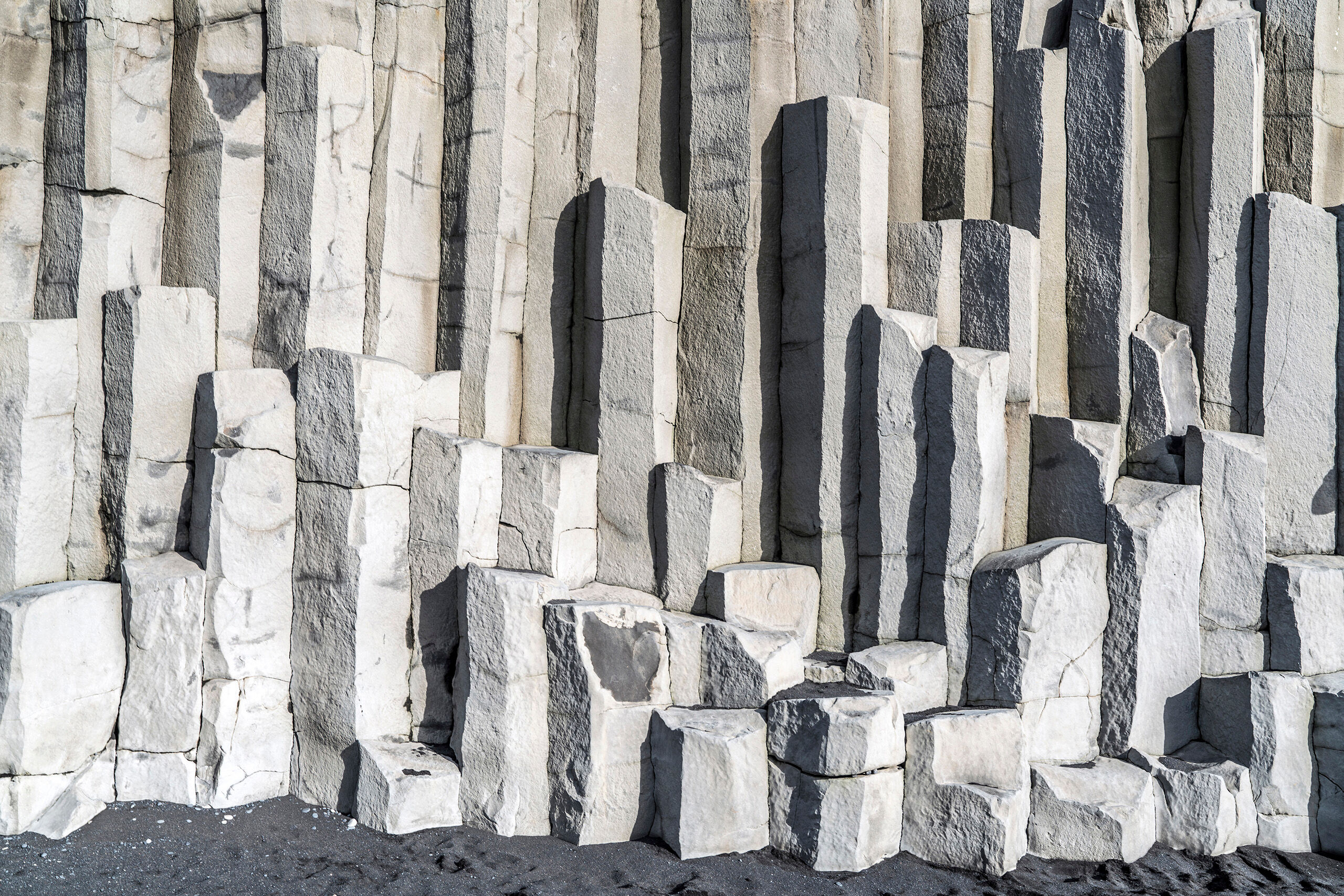 Basalt Columns in Vik (Landscape) Iceland's volcanic history is evident everywhere. Case in point: the hexagonal basalt columns rising straight out of the black...