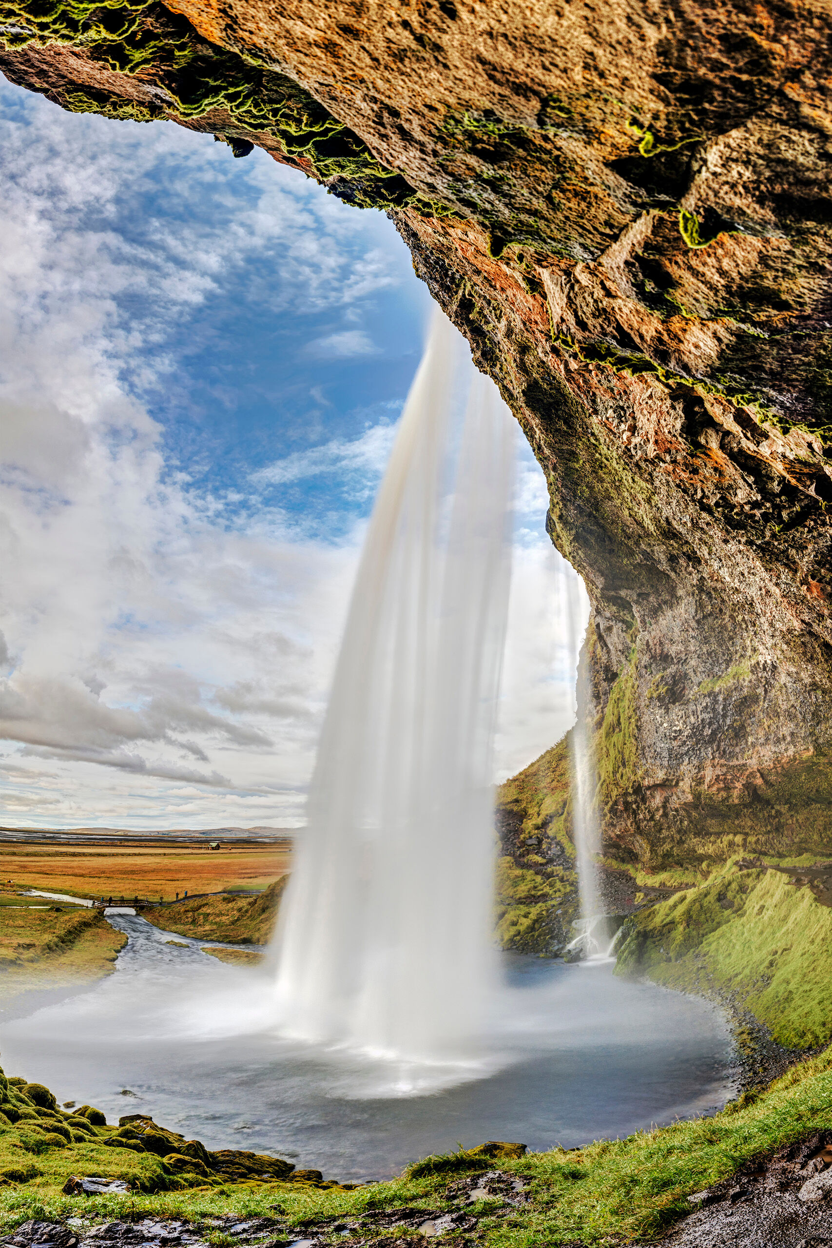 Behind Seljalandsfoss Seljalandsfoss is one of Iceland's most famous waterfalls, partially because it is the only one (that I know of, anyway) that...