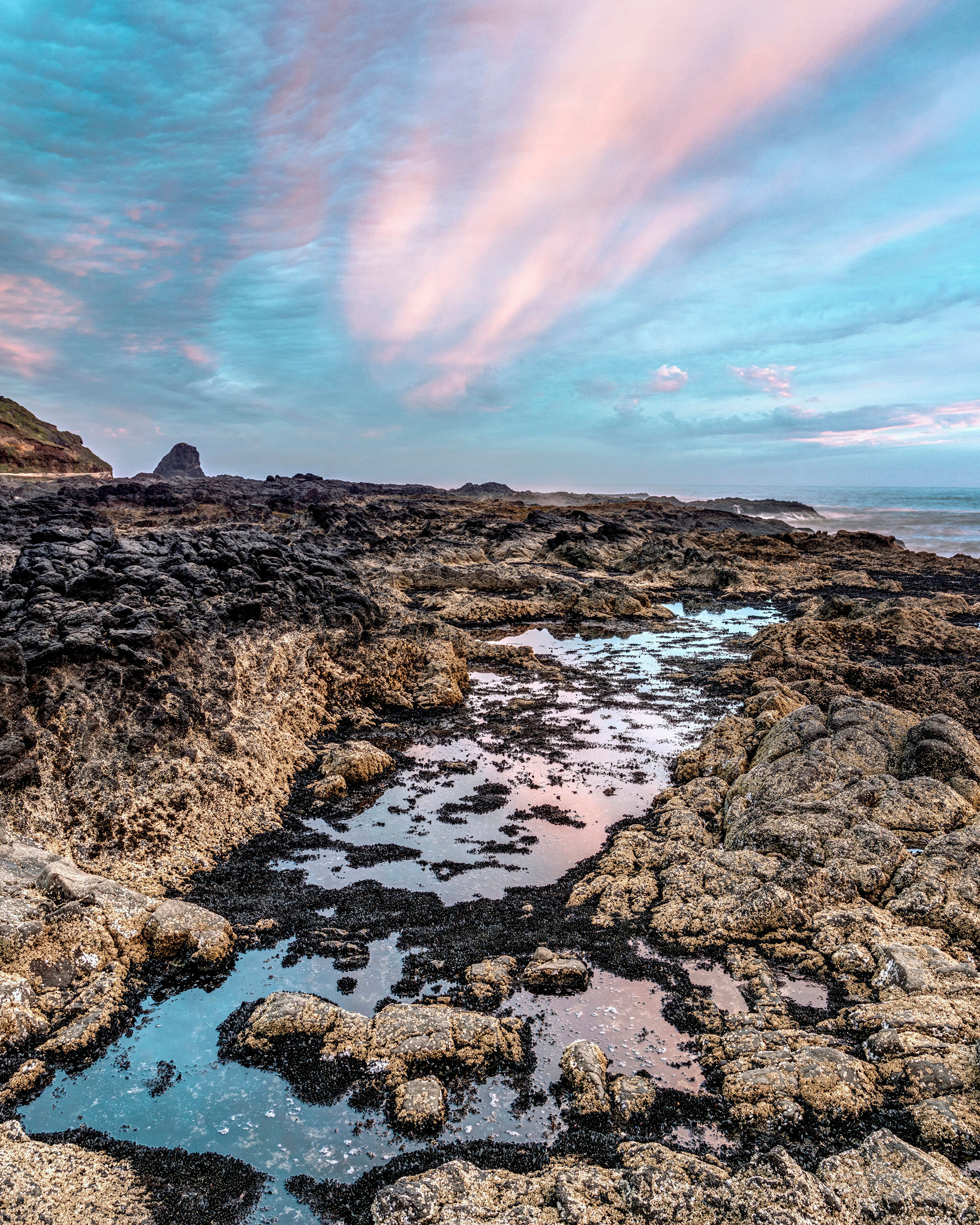 Sunset at Perpetua Marine Garden Portrait There is no shortage of spectacular spots along the Oregon Coast to photograph the sunset, but my July, 2018 trip to the Pacific...