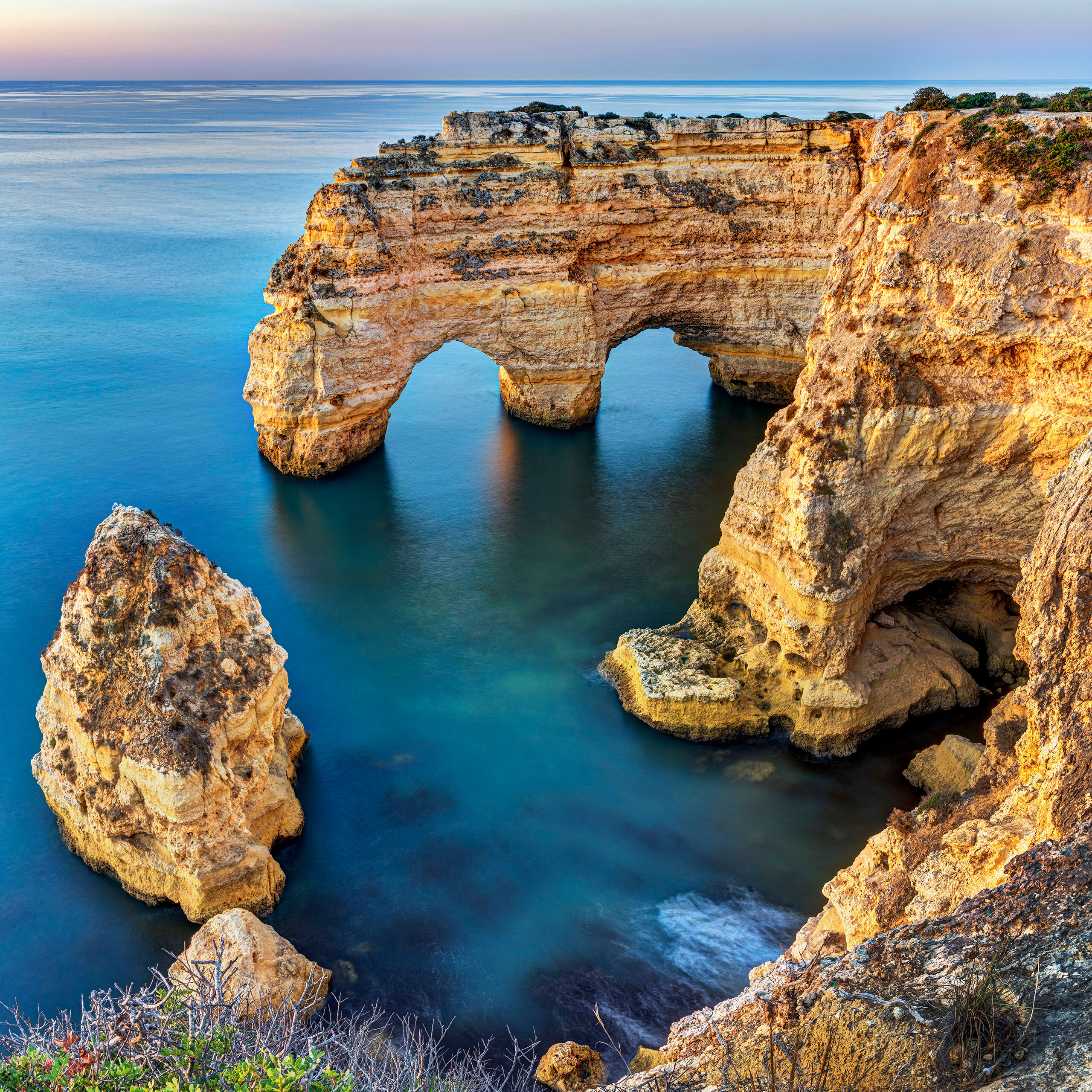 Double Arch at Praia Marinha Yet another shot of the double arch at Praia Marinha, in southern Portugal.