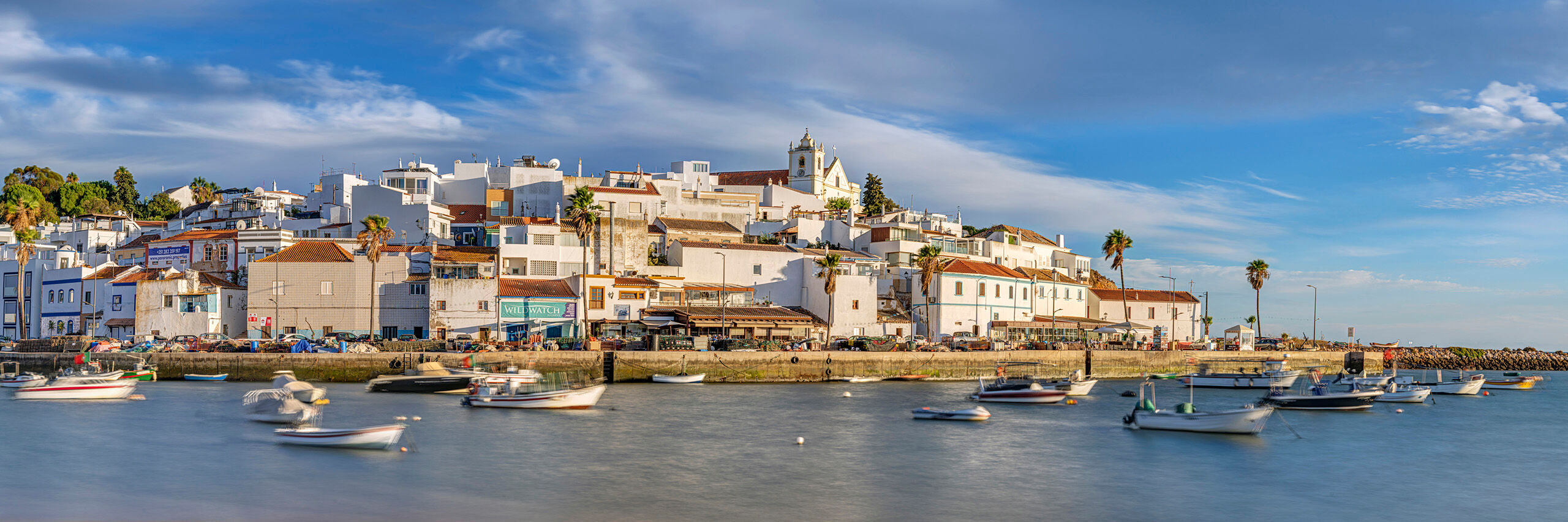 Ferragudo Panorama Southern Portugal has some absolutely spectacular beaches and cute seaside villages, like Ferragudo, shown here. With a population...