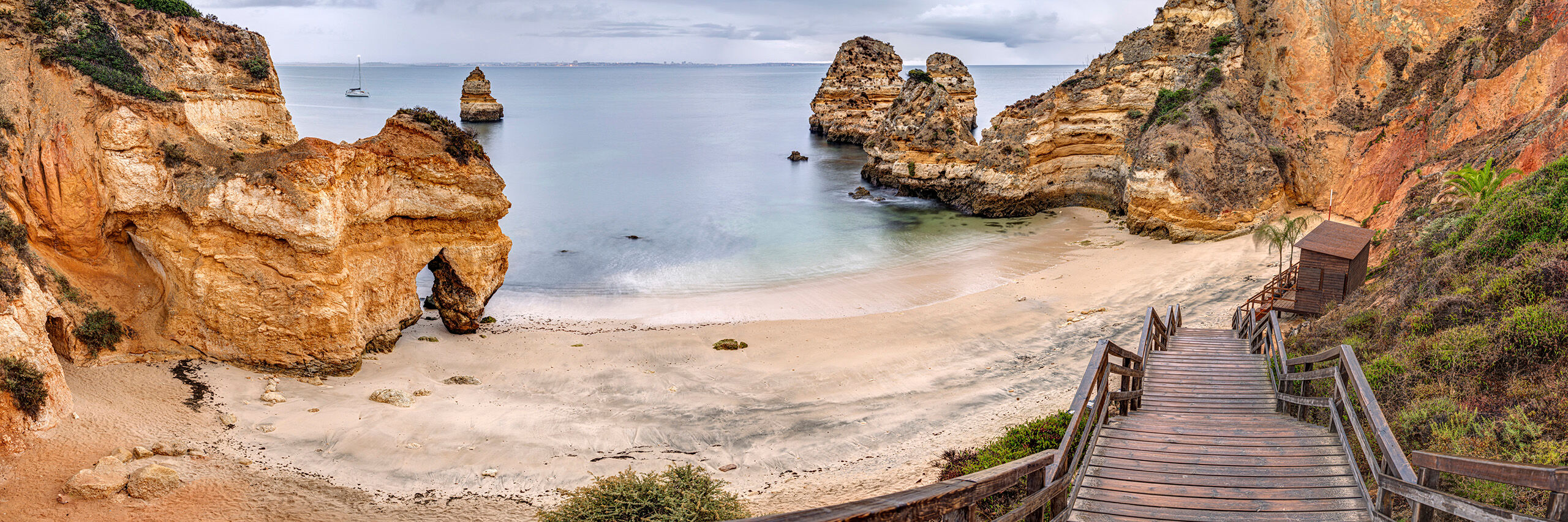 Praia Dona Ana Praia Dona Ana might be the most famous beach outside of Lagos, Portugal. This popularity is, of course, a double-edged sword...