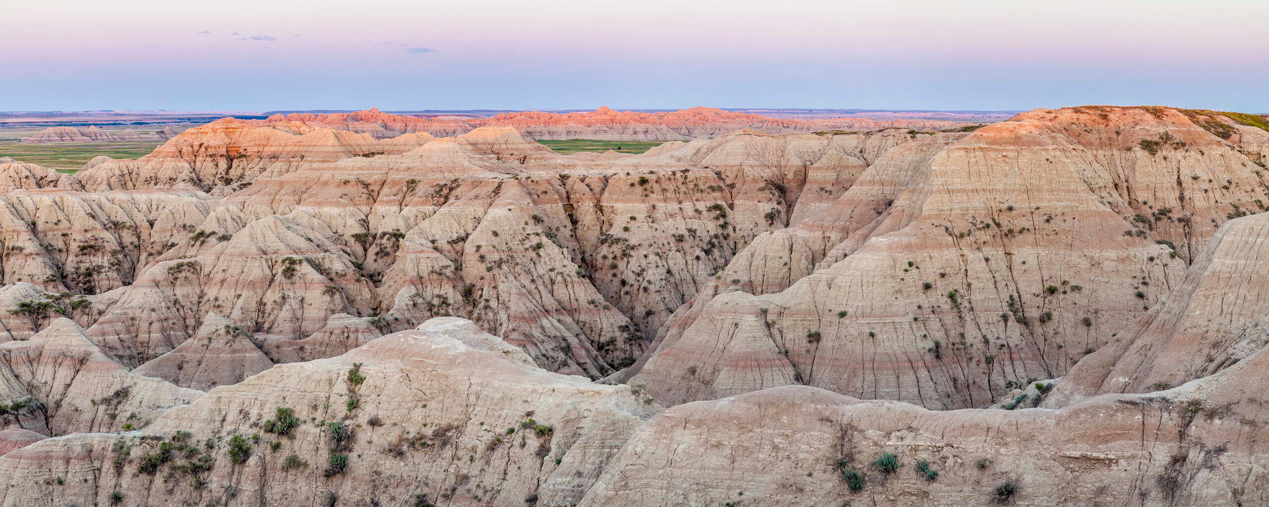 Badlands Dawn Panorama Badlands National Park, in southwest South Dakota, is otherworldly. Occupying close to 400 square miles, it is filled with fascinating...