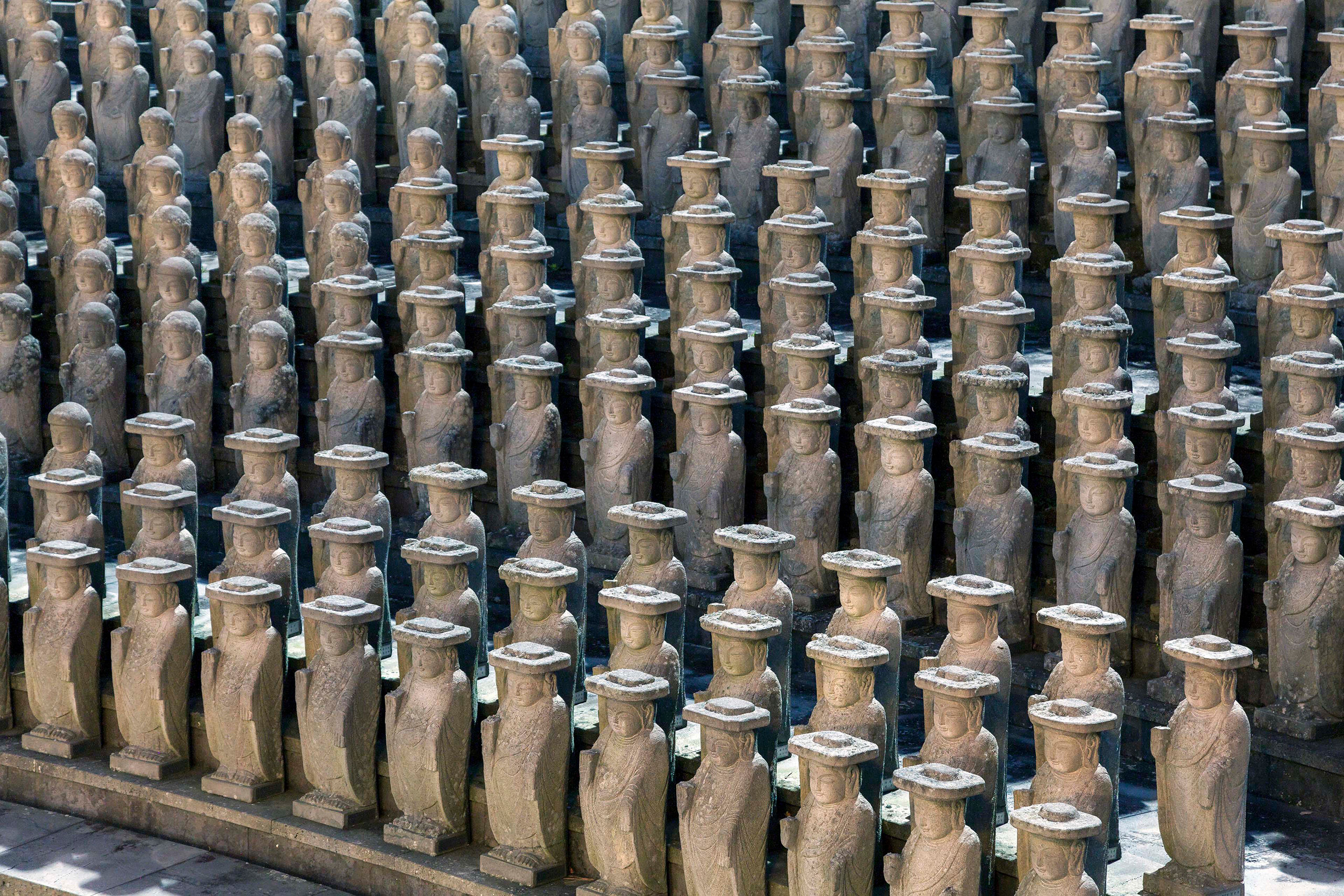 Stadium of Statues More than a hundred of roughly one thousand small (roughly two feet tall) Buddhist statues that surround a large, golden Buddha...