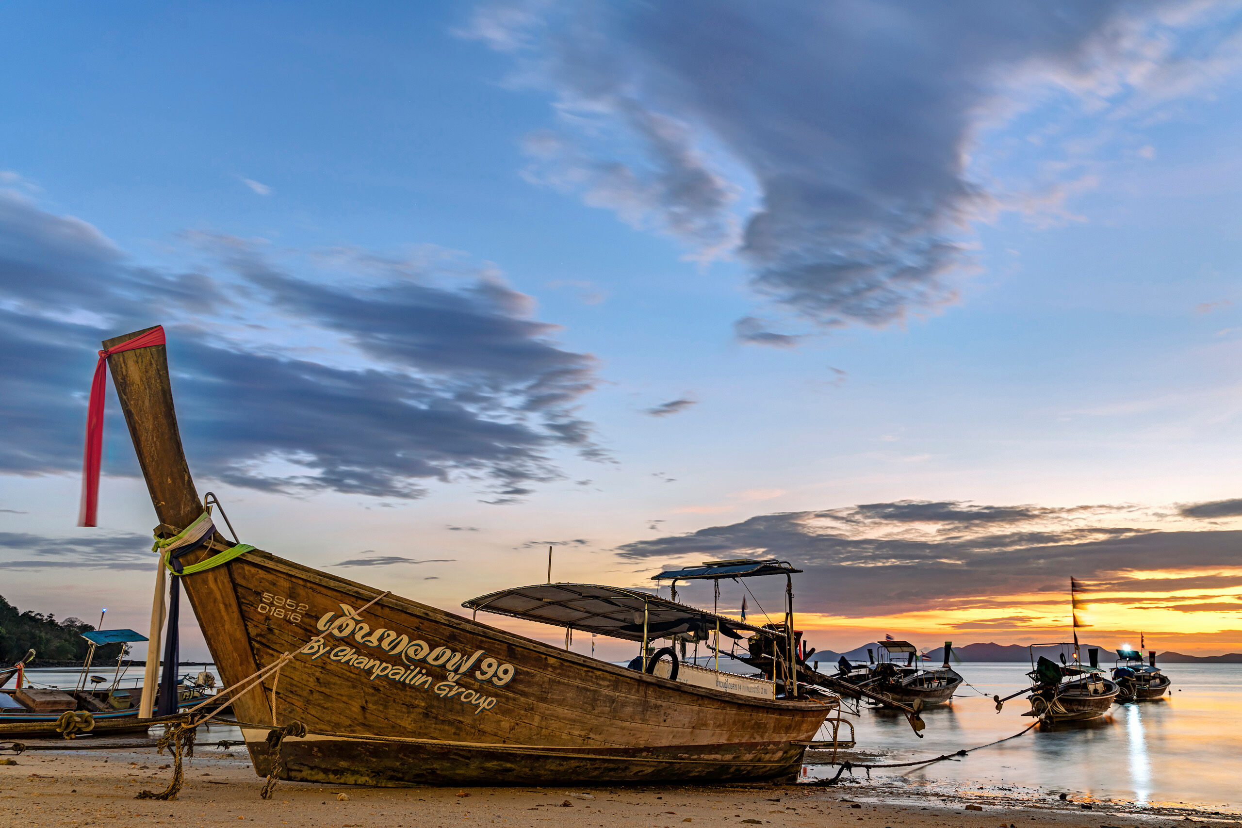 Phang Nga Bay Sunset “Long-tail” boats are synonymous with Thai beaches. Here are a few that I photographed shortly after sunset on an...